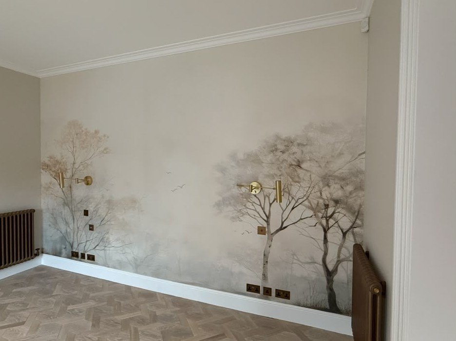 Misty tree-line mural hung around wall lights and sockets, Mayfair Project — view 2